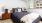 Studio Apartments in San Jose CA - LINQ - Bedroom with Carpeted Floor, Bed, Nightstands with Lamps, and Window